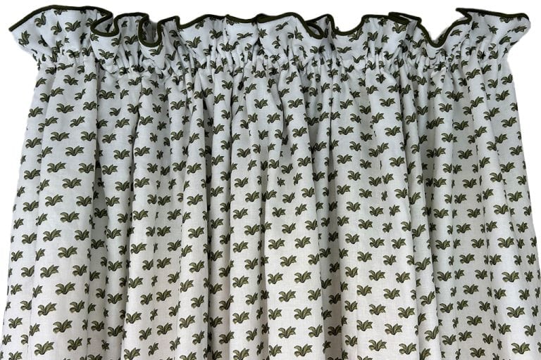 Floral patterned curtains with gathered top.